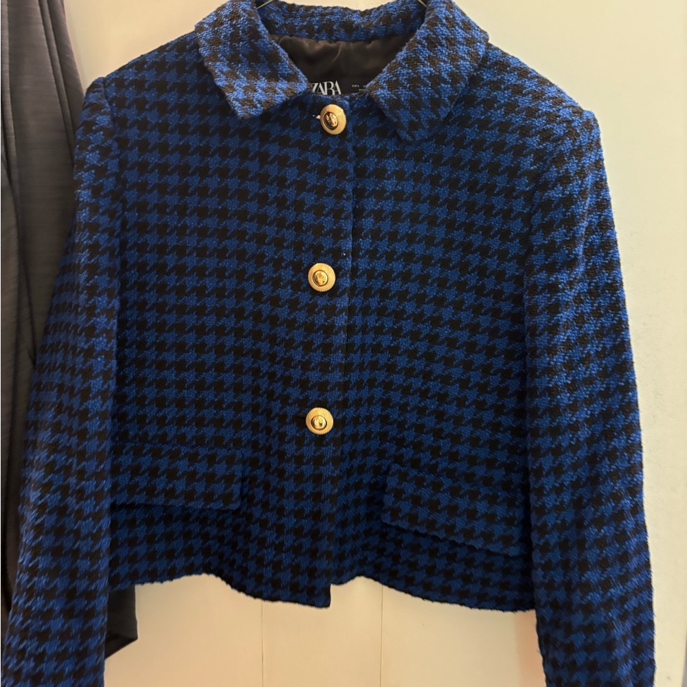Tweed black and blue dress jacket with gold buttons.